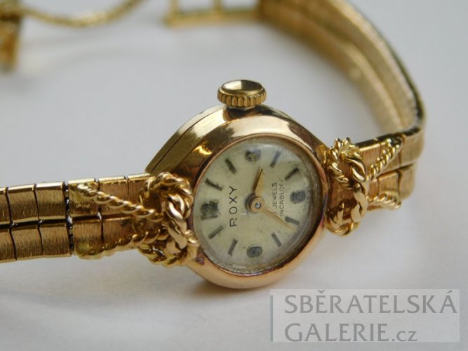 Dámské náramkové hodinky - puncované zlaté 18 k - zn. ROXY - váha 22,1 g