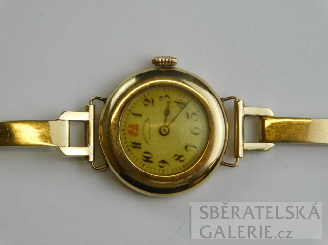 Dámské náramkové hodinky - puncované zlaté - zn. MOVADO - váha 23,3 g
